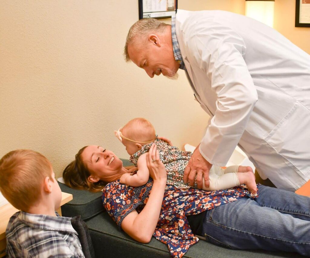 Dr.-Anderson-with-mom-and-baby-girl Pediatric & Family Chiropractor Directory | PX Docs